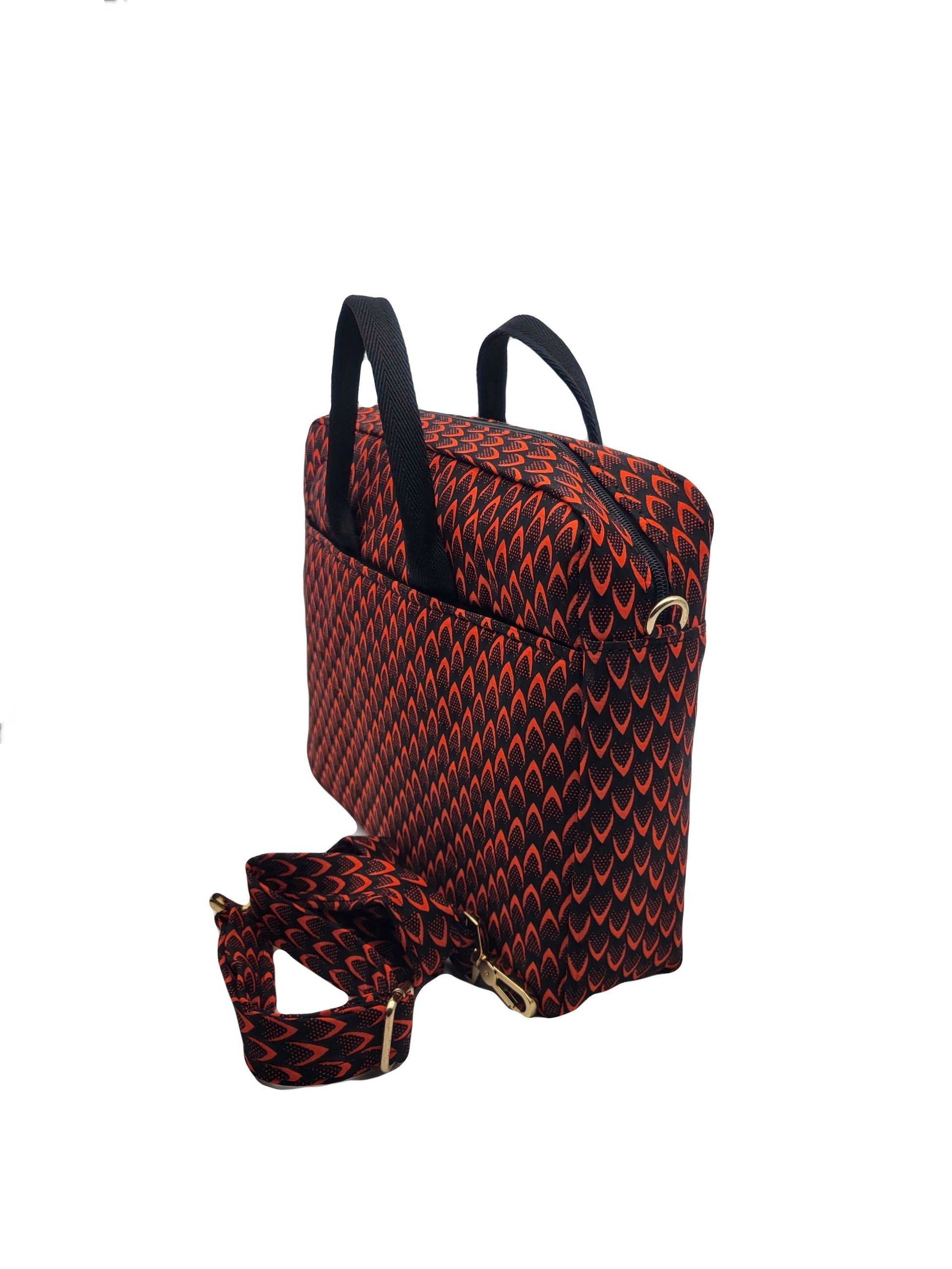 Glam Origins Laptop Bag Red  Ankara/Kente 
Fabric known as "Fish scales"
13" or 12"
Handle and Ankara shoulder strap
Do not bleach
Spot Clean 
Made in Nigeria Laptop Bag Red