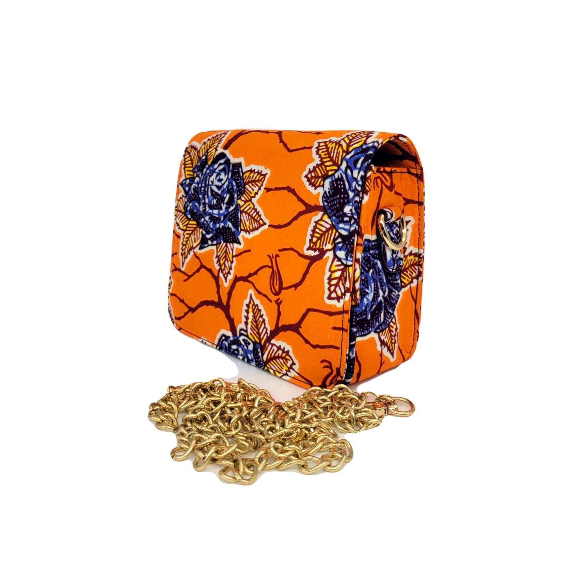 Glam Origins Lili Ankara Mini Clutch bag Handbags 
Handmade
Ankara
Vibrant Colors
Can be used as clutch or Chain handbag
Spot Clean
Do not bleach
Made in China
 Lili Ankara Mini Clutch bag