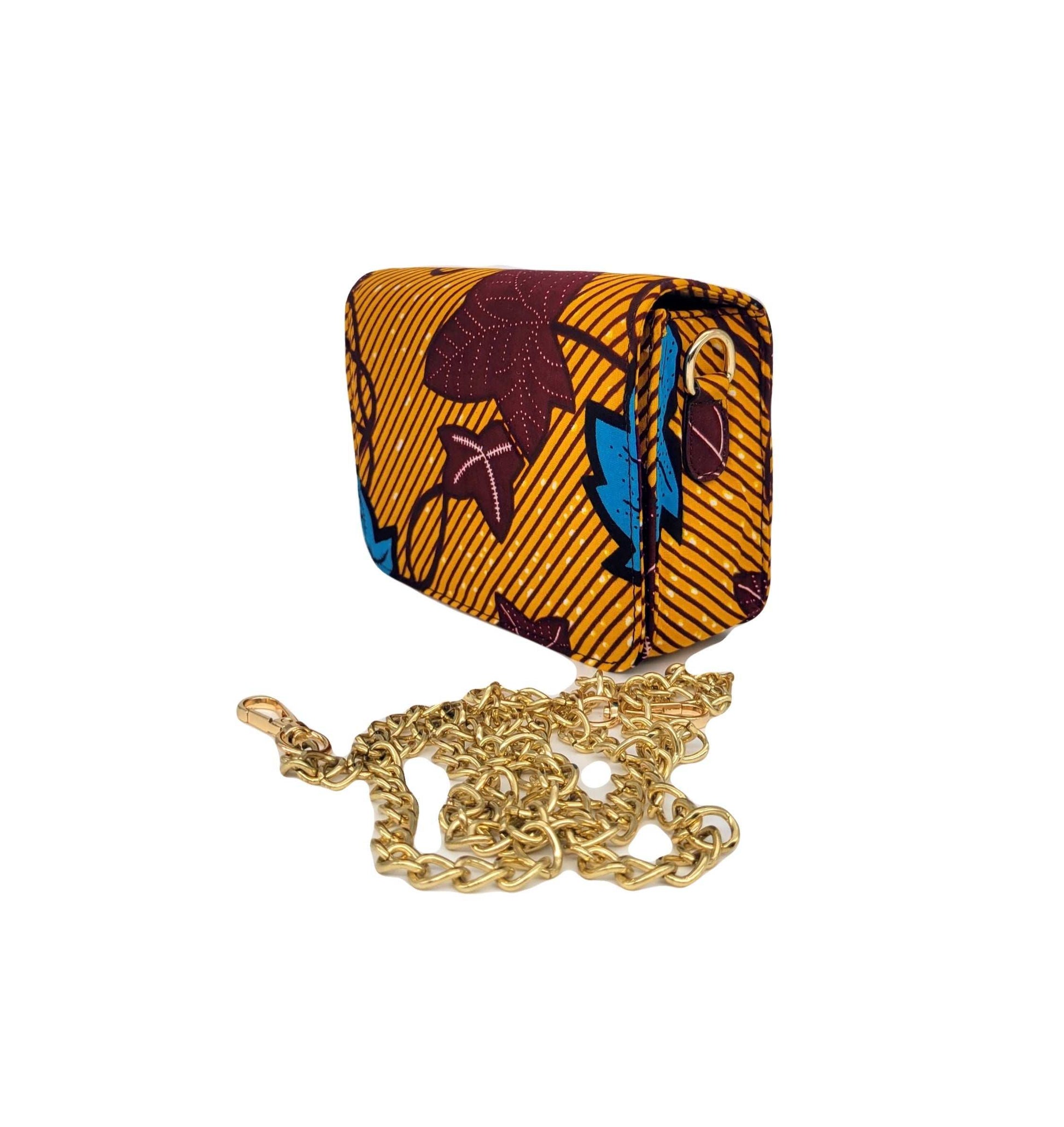 Glam Origins Lili Ankara Mini Clutch bag Handbags 
Handmade
Ankara
Vibrant Colors
Can be used as clutch or Chain handbag
Spot Clean
Do not bleach
Made in China
 Lili Ankara Mini Clutch bag