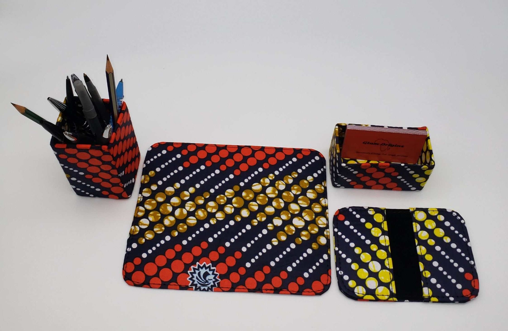 Glam Origins Noor Ankara Office set Office Sets 	Ankara Office set	Set of 4	Mouse pad, Pen/pencil holder, Cardholder, Card wallet	Ankara Fabric	Spot clean	Made in Nigeria
  Noor Ankara Office set