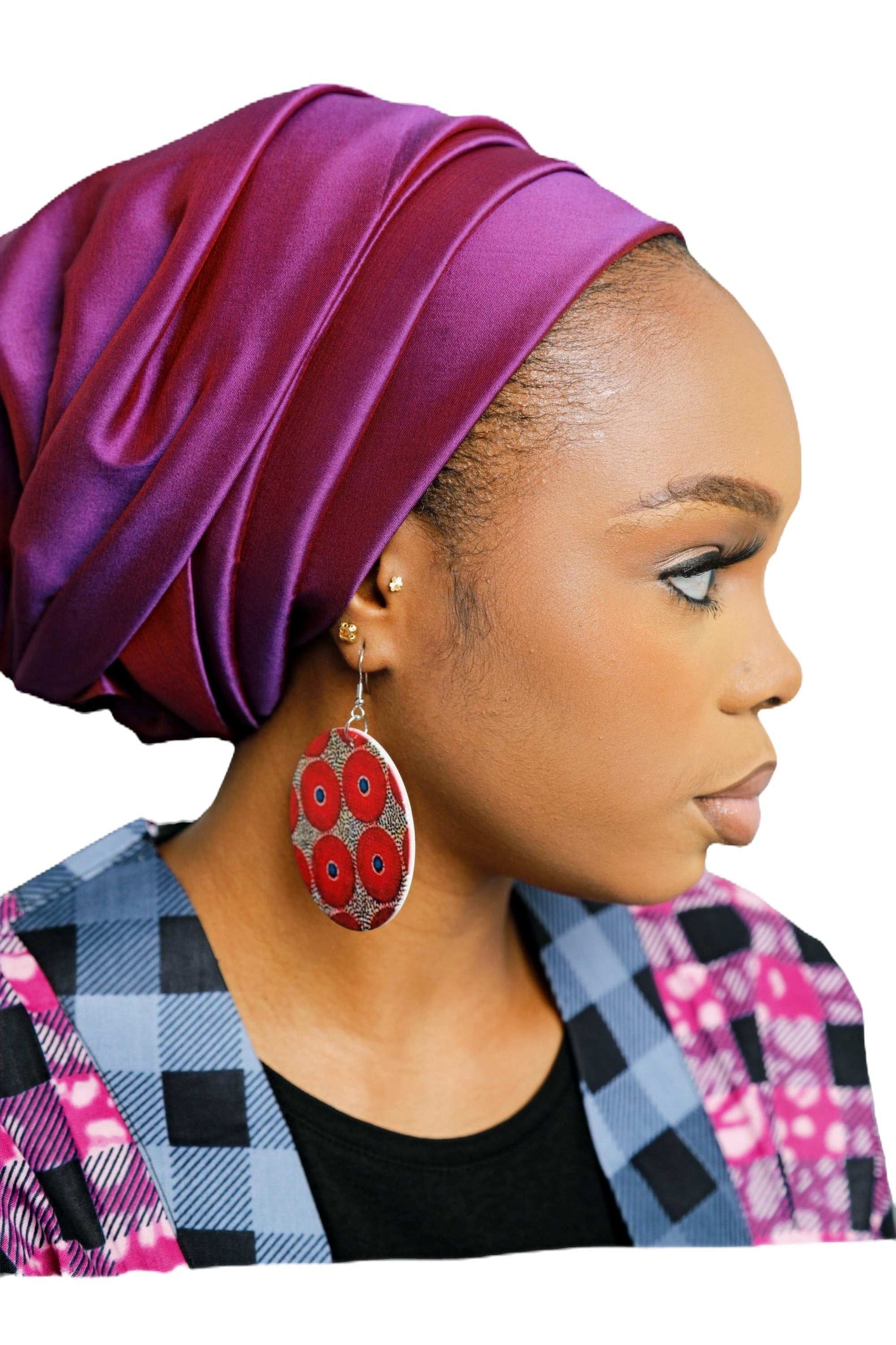 Glam Origins Mariam Large Handmade Wooden Round Bohemian Earrings Earrings 
Stylish Large Handmade wooden earrings
Round
Oil painted
African ankara fabric design
Vibrant Colors
Silver hook
Weight: 0.4oz (0.2oz each)
Lenght: 4"
Width: 2.5"
 Mariam Large Handmade Wooden Round Bohemian Earrings