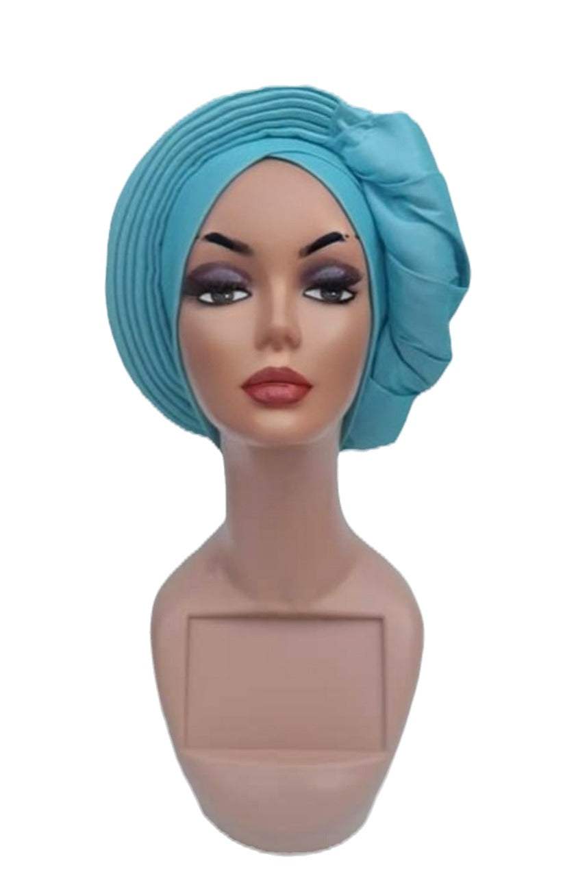 Glam Origins Meena Turquoise Silk Turban Turbans 	Handmade silk turbans	Adjust to fit	Vibrant Colors	Stylish	True to roots	Spot clean	Best dry clean	Made in Nigeria
 Meena Turquoise Silk Turban